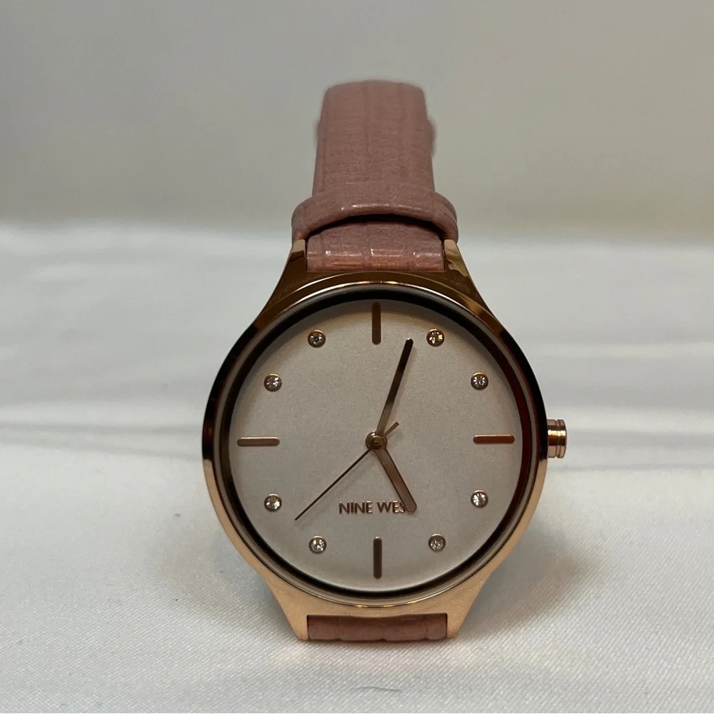 COPY - NWOT. Woman’s Nine West Gold Tone Watch with Pink Strap